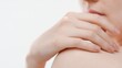 © pavel_dp - Big close-up shot of female hand lays on shoulder against white background | Skin brightening concept