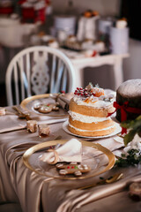 Canvas Print - Christmas table with a yummy cake and muffins