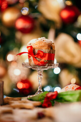 Sticker - Yummy cupcake with a red bow in the Christmas background