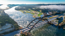 Aerial View Of An Arch Bridge Over The Colorado River In Austin