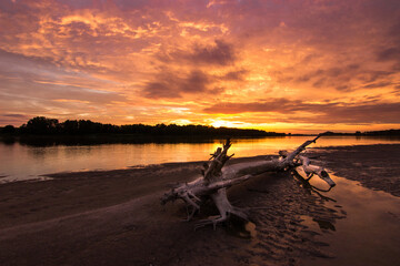 Colorful cloudy sky over the Po River in Italy at sunset