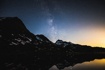 Sticker - Dark sky in the night with stars and milky way above the snowy mountains