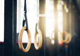 Fototapeta Krajobraz - Give your body a lift. Shot of gymnastic rings at the gym.