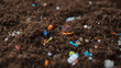 Microplastics inside the soil. Concept of global warming and climate change. Non-recyclable plastic pollution in the soil at the field.s