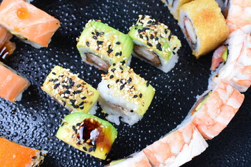 Sticker - Traditional colorful suhi, cream cheese, salmon, caviar, rool sishi crunch, sesame seeds and sauce