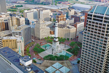 Monument Circle In The Heart Of Downtown Indianapolis, Indiana, USA, Is Seen From A High Angle.