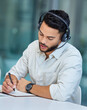 © Delcio Fernandes/peopleimages.com - Let me walk you through it.... Shot of a young businessman making notes while working in a call center.