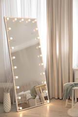 Wall Mural - Large mirror with light bulbs near window in room. Interior design