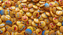 3D Rendering Of A Bunch Of Emojis With Faces Representing Different Emotions.