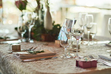 The table setting is looking on point. Shot of a nicely set table with cutlery and crockery placed together inside of a building during the day.