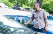 © JackF - Portrait of man who is standing near his car outdoors.