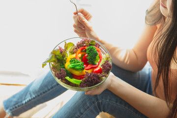 asian woman with healthy food,  Beautiful girl eating a salad in house, health care eat vegetables and useful foods lifestyles concept.