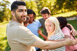 © Robert Kneschke - Young people embrace as a community in a circle