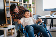 © NDABCREATIVITY - Single parent with asian child with disability in wheelchair