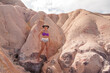 Fit Woman standing at the Colorful Red Cliffs known as the Falesias near Arraial d’ Ajuda, Bahia, Brazil

