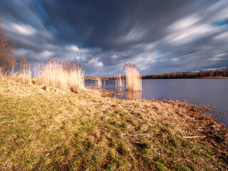 Wall Mural - Stormy lake landscape at Tychy Poland during winter time 