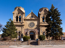 The Facade Of The 1887 Romanesque Revival Cathedral Basilica Of Saint Francis Of Assisi In Downtown Santa Fe, New Mexico, USA