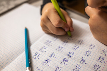 mathematical examples that the student writes and solves. sum and subtraction. algebra. pen and penc