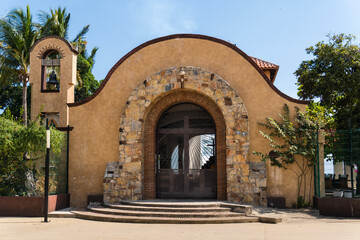 Chapel of Santa Cruz in Huatulco, Oaxaca, Mexico. Famous for wood cross relic. A bearded man brought log to beach. Worshiped after it resisted attack from pirates Francis Drake and Thomas Cavendish.