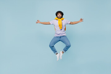 Wall Mural - Full size young bearded Indian man 20s years old wears white t-shirt hold spreading hands in yoga om aum gesture relax try to calm down isolated on plain pastel light blue background studio portrait.