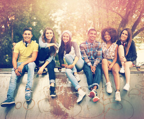 Poster - Having a chilled time at their favorite hangout. Portrait of a group of friends hanging out together in an urban setting.