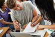© Jeff B/peopleimages.com - Study partners. A young male and female student studying in a classroom.