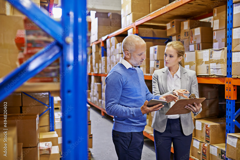 WE always double check our shipments. Shot of a man and woman ...