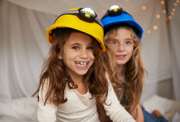 Sticker - Theyre determined to have fun. Shot of two cute little girls having fun during a sleepover.