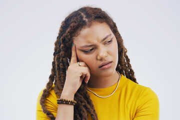 Sticker - I just cant come to a conclusion. Studio shot of a young woman looking thoughtful against a gray background.