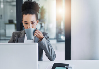 Wall Mural - coffee, then down to business. cropped shot of an attractive young businesswoman drinking a cup of c