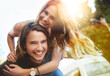 © Delmaine Donson/peopleimages.com - Love will set you free. Portrait of a happy young couple enjoying a piggyback ride outdoors.