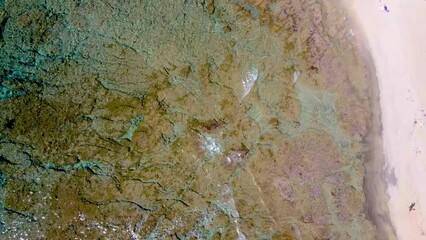 Wall Mural - Aerial view of a man walking in La Speranza foreshore. Sardinia, Italy