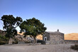 Small stone chapel at Nida Plateau. Blue sky. Crete island, Greece.