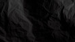 Black crumpled paper background with copy space for image or text 