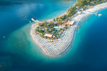 Wall Mural - aerial view to end of sandbar with beach with umbrellas in city Oludeniz in Turkey