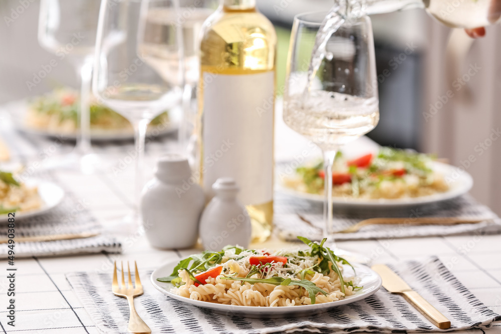 Plate of delicious pasta on table in restaurant
