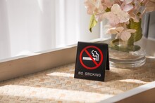 No Smoking Sign In Hotel Room With Sunlight From Curtain Window. Healthcare Concept.