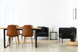 Leinwandbild Motiv Interior of modern dining room with table and black armchairs