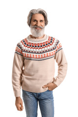 Canvas Print - Handsome senior man in knitted sweater on white background