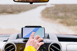 © ADDICTIVE STOCK - Unrecognizable man turning on GPS in car