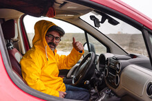 Man Showing Thumb Up In Car