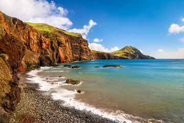 beautiful scenery of hills by the coastline of the atlantic ocean in funchal city, portugal