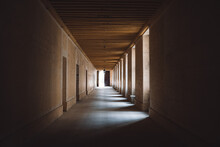 Closeup Of A Long Hallway With Lights Between Columns