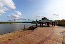 View Of Julien Dubuque Bridge And A Gazebo By Mississippi River Against A Blue Sky On A Sunny Day