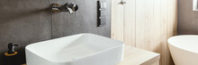 Sinks In An Elegant White, Concrete And Wooden Bathroom
