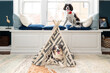 adorable mini aussie lying down in teepee for dogs with pretty springer spaniel on window seat - cute miniature australian shepherd in dog bed tent