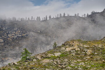 Sticker - Russia. South of Western Siberia, Mountain Altai. Morning frosty fog on the tops of the rocks along the Biya River.