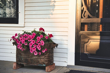 Closeup of an old copper tub with flowers