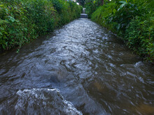 Natural View Of Water Flowing Downstream In A River