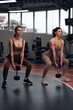 © astrosystem - Pretty women working out in a gym. Adult ladies with beautiful shaped bodies.